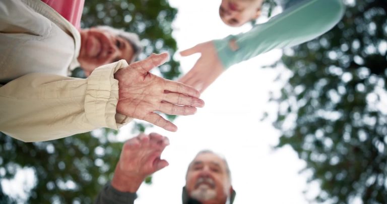 Volunteers holding hands